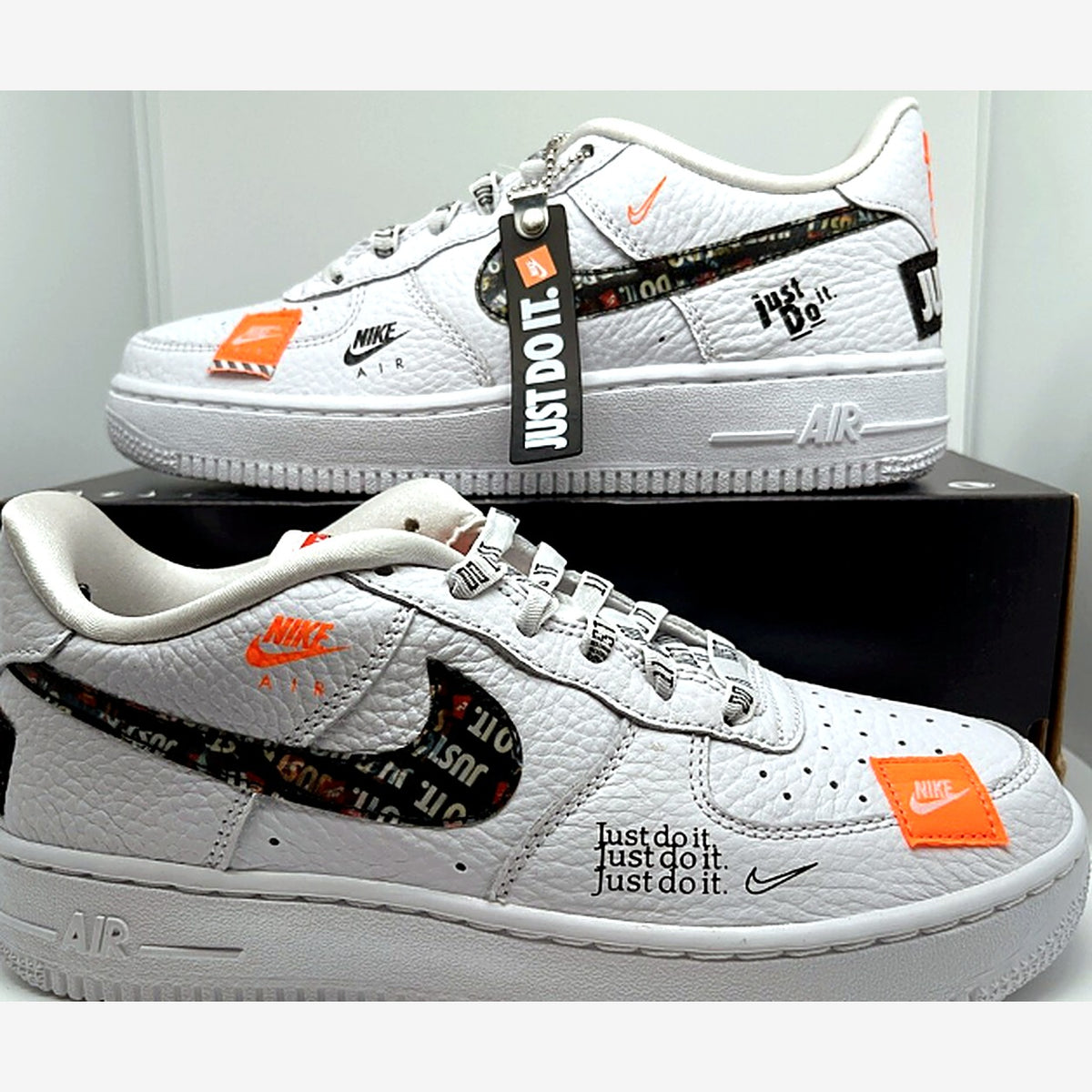 Nike Air Force 1 Low Just Do It in white with orange accents